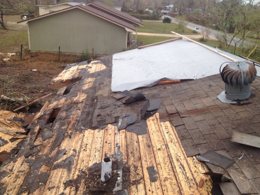 Shingles removed, damage is bad.